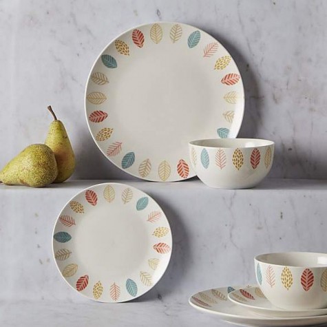 A 12-piece dinner set with bright leaf and lace